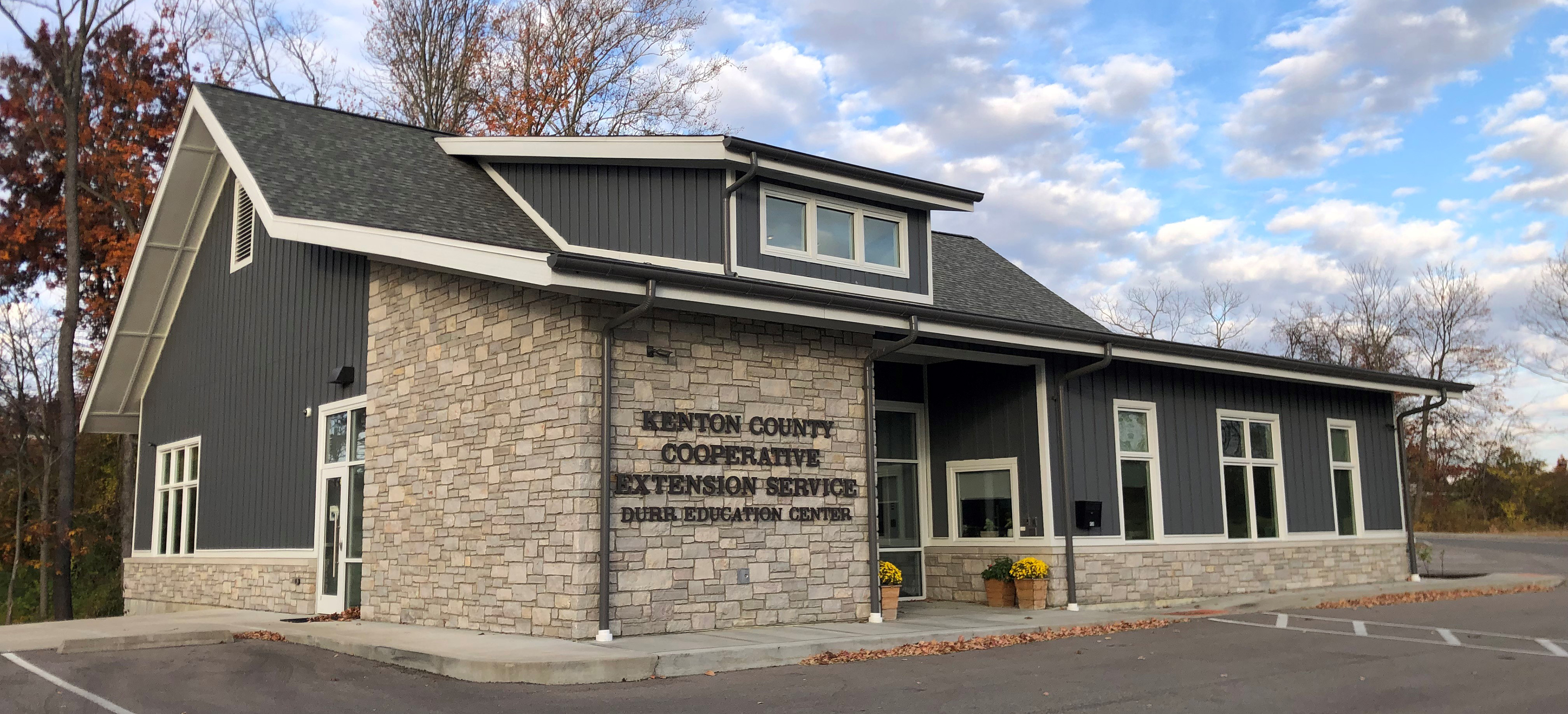 The Kenton County Cooperative Extension Durr Education Center. A single story gray building with white trim.